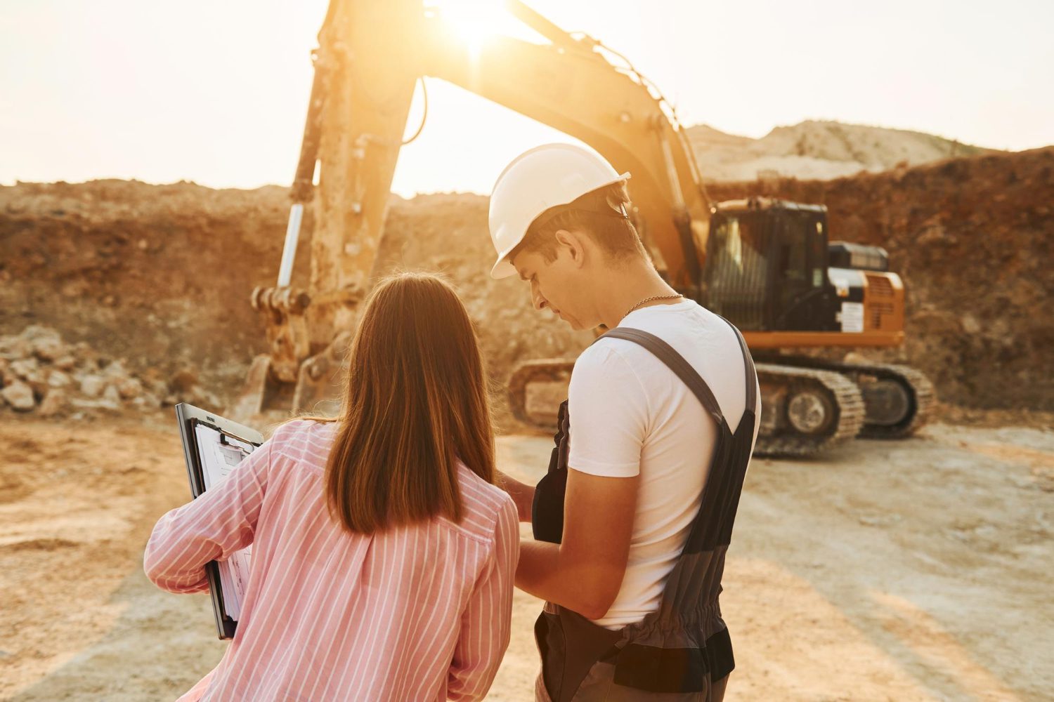 Construction workers discussing plan at jobsite